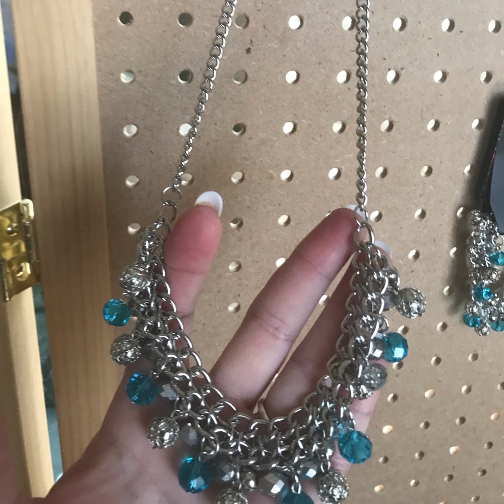 Silver necklace w/aqua, silver, & crystal beads.